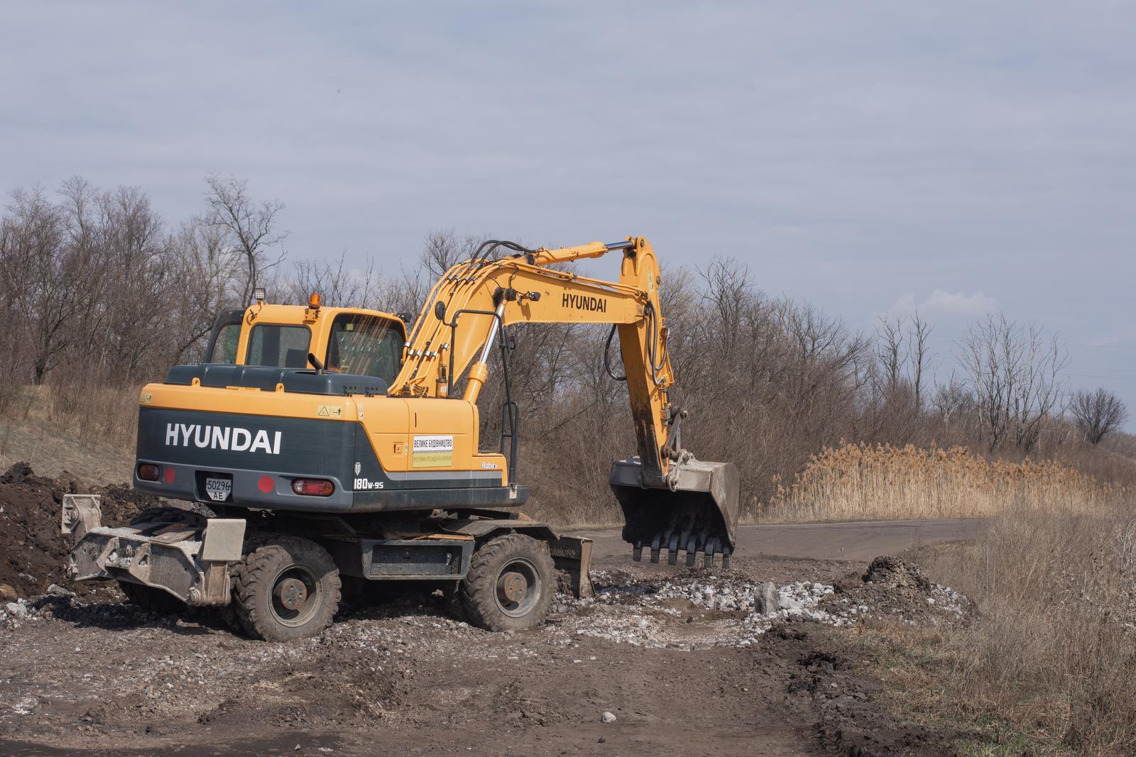 excavator in the mud