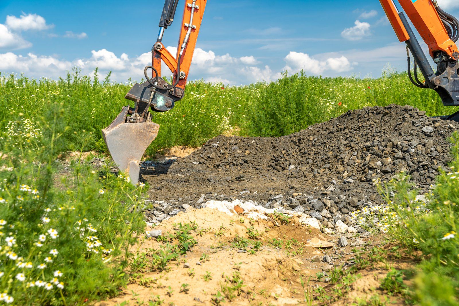 pile of stones and soil in the field