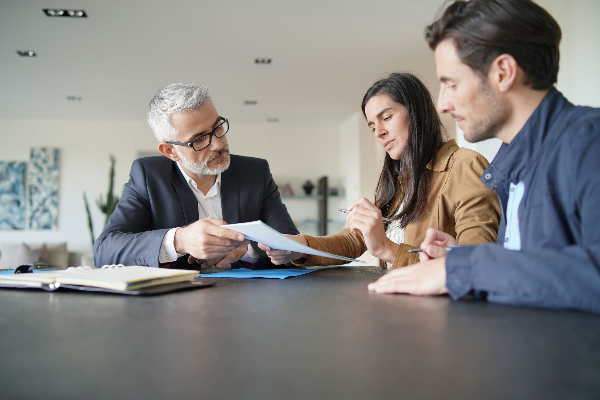 A couple is going over a document for estate planning.