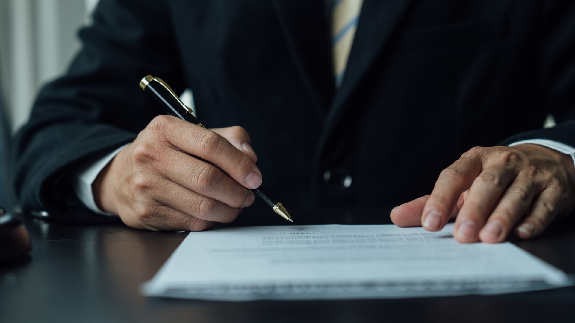 Professional signing legal documents as part of comprehensive estate planning services. Professional signing legal documents as part of comprehensive estate planning services.