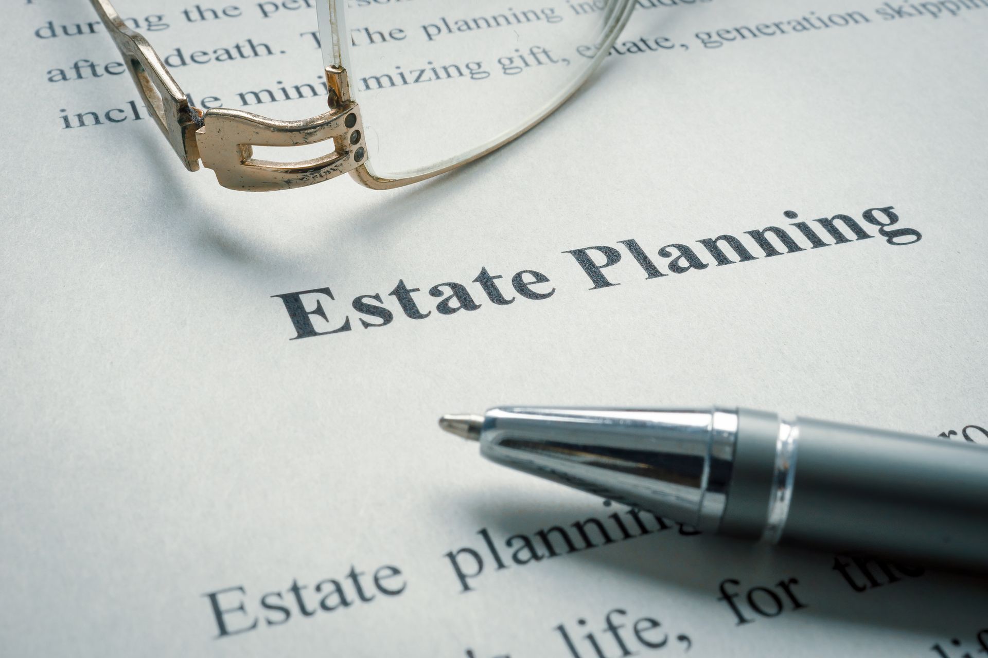 A pair of glasses over an estate planning document.
