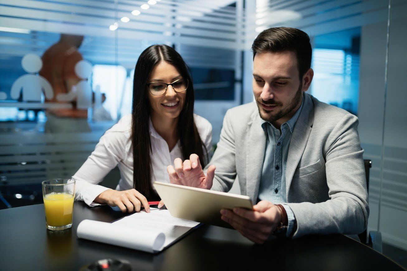 Two Accountants Checking a Paper — Olympia, WA — Bliss & Skeen, CPAs Two Accountants Checking a Paper — Olympia, WA — Bliss & Skeen, CPAs
