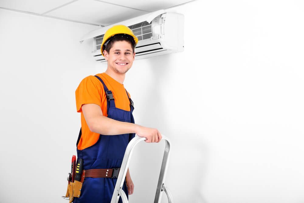 Technician Repairing Air Conditioner — HVAC Systems in Dubbo, NSW
