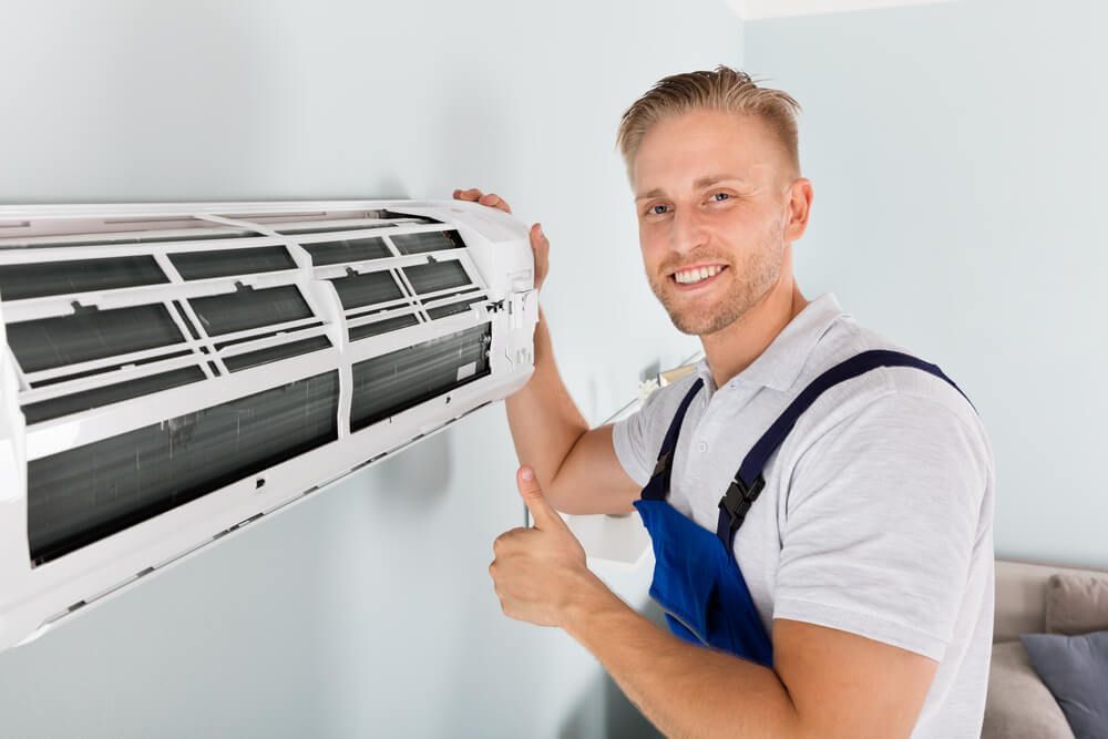 Electrician Gesturing Thumbs Up  —  HVAC Systems in Forbes, NSW