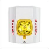White wall-mounted alarm with yellow center beacon and red “ALERT” text on both sides