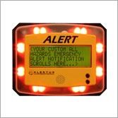 Orange ALERT electronic sign with flashing lights and scrolling warning text