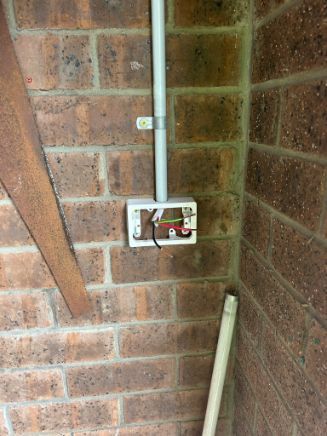 Electrical Outlet Box on Brick Wall With Exposed Wires — Fry Electrical In Gorokan, NSW