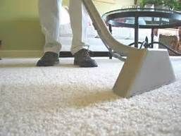 Professional carpet cleaning with hot water extraction