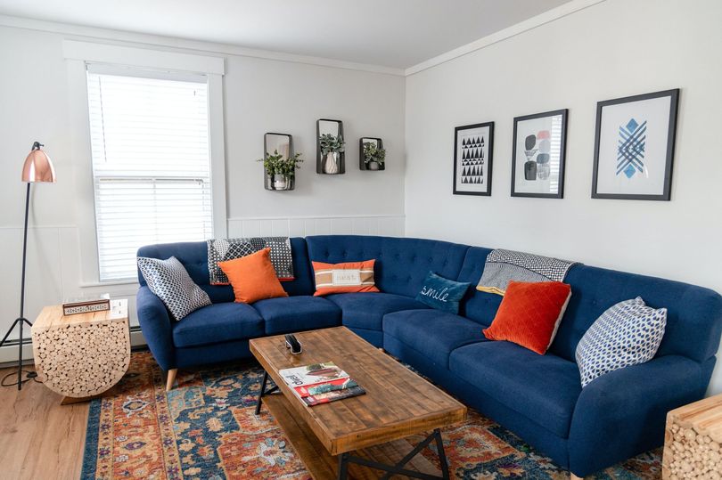 Upholstery cleaning on deep blue sofa