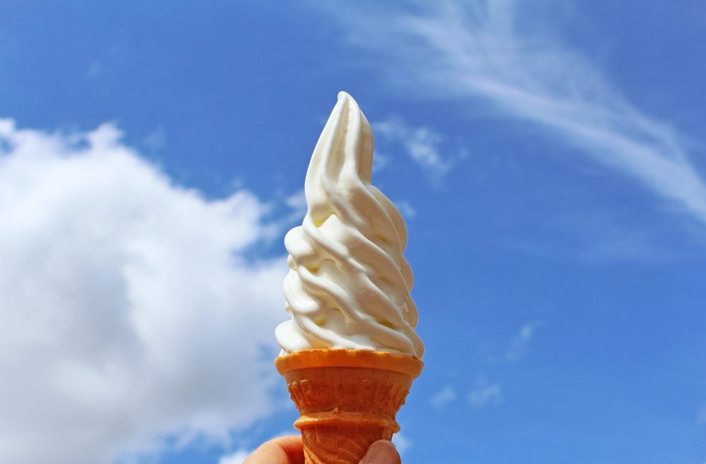 A Person is Holding an Vanilla Ice Cream Cone — Frosty Whip in Rasmussen, QLD