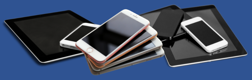 A stack of cell phones and tablets on a blue background.