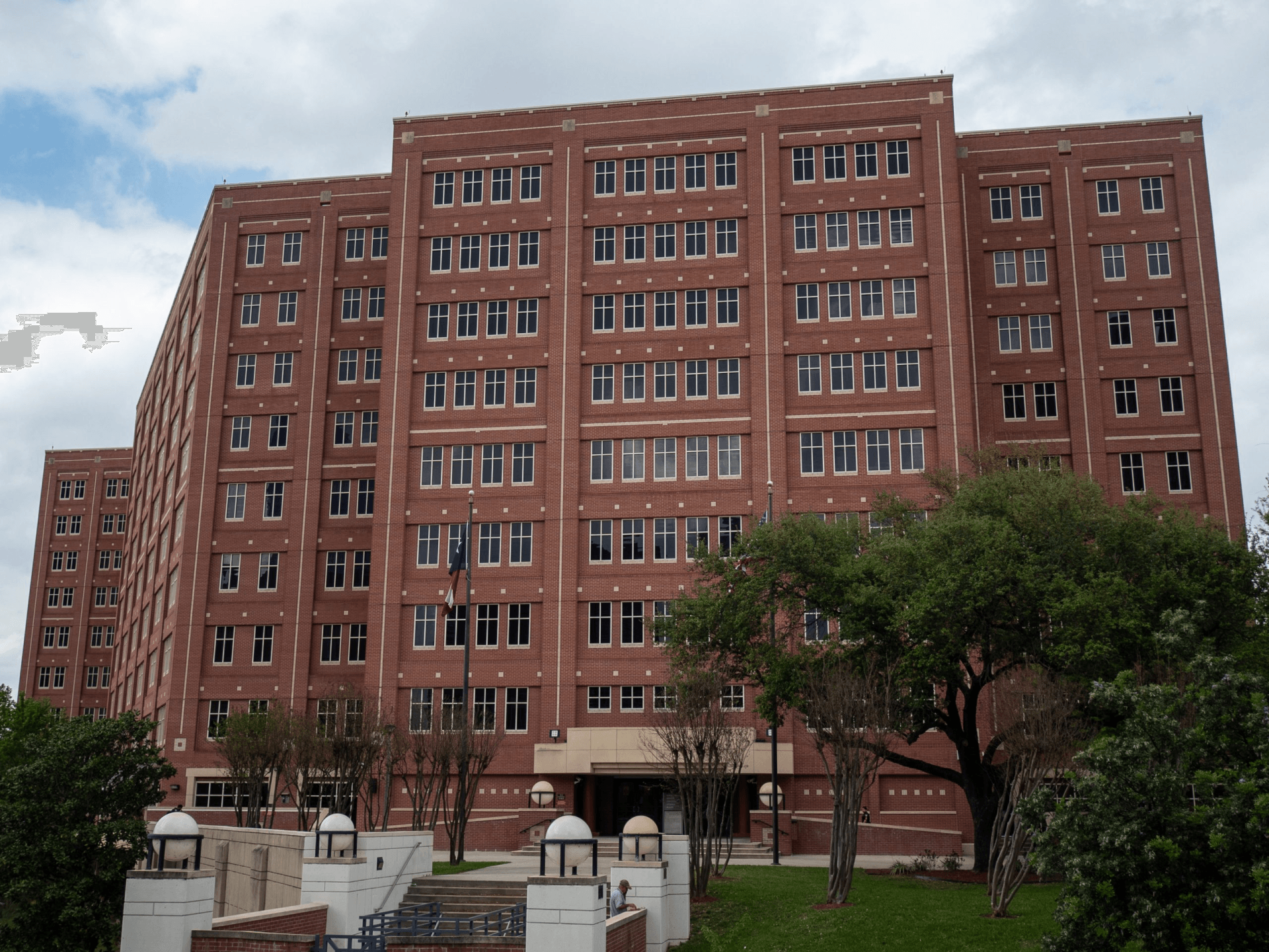 A large brick building with a lot of windows