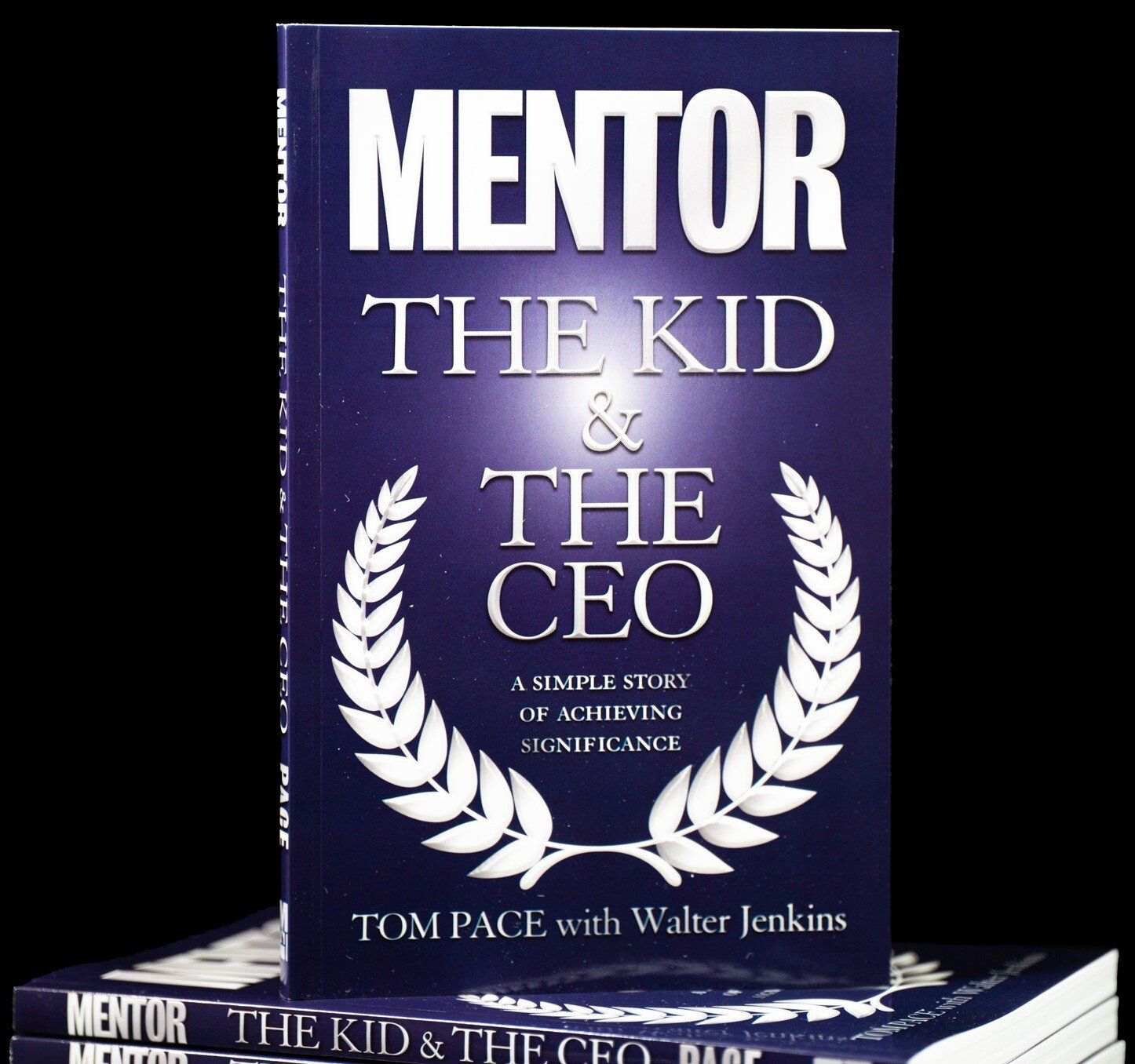 A book titled mentor the kid and the ceo