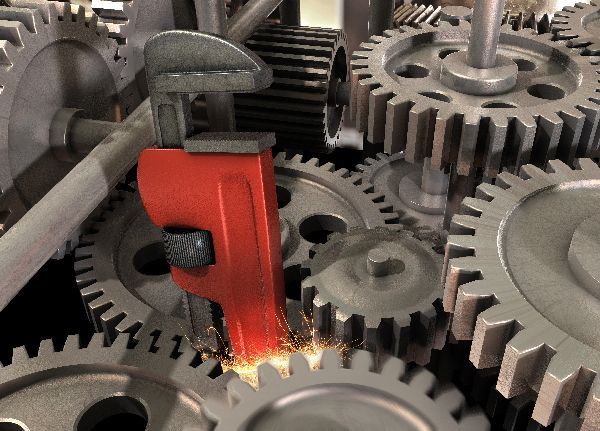 Red pipe cutter cutting a metal pipe amid gears, with sparks flying.