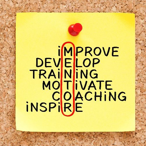 A yellow sticky note on a corkboard displaying an acrostic for MENTOR using words related to professional development.