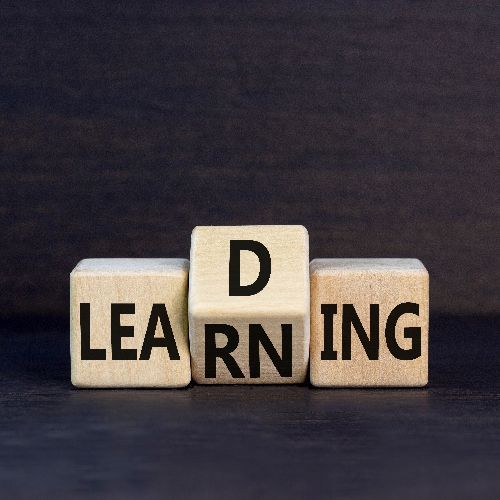 Three wooden blocks arranged to spell