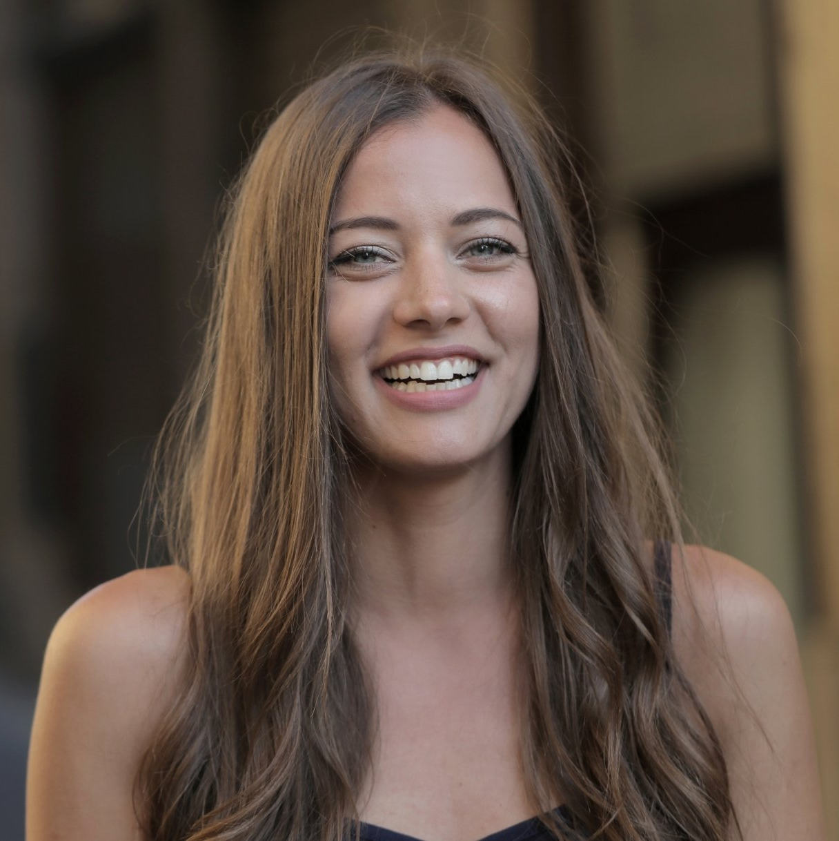 A smiling woman with long brown hair