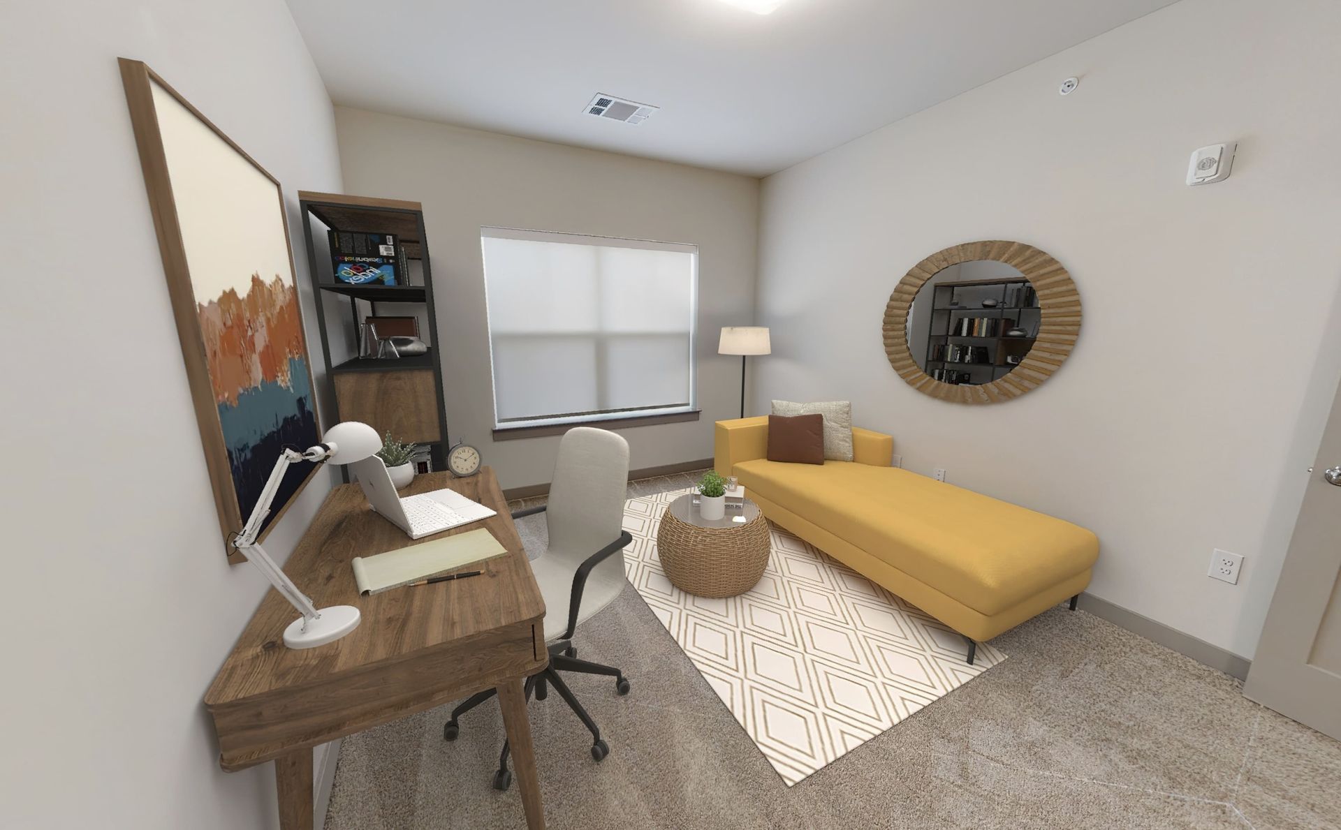 A living room with a couch , desk and chair