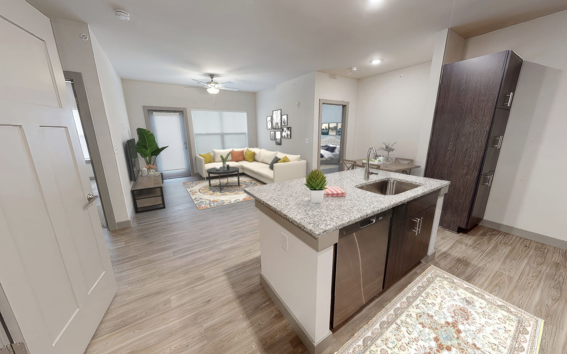 A 3d model of a living room and kitchen in a house