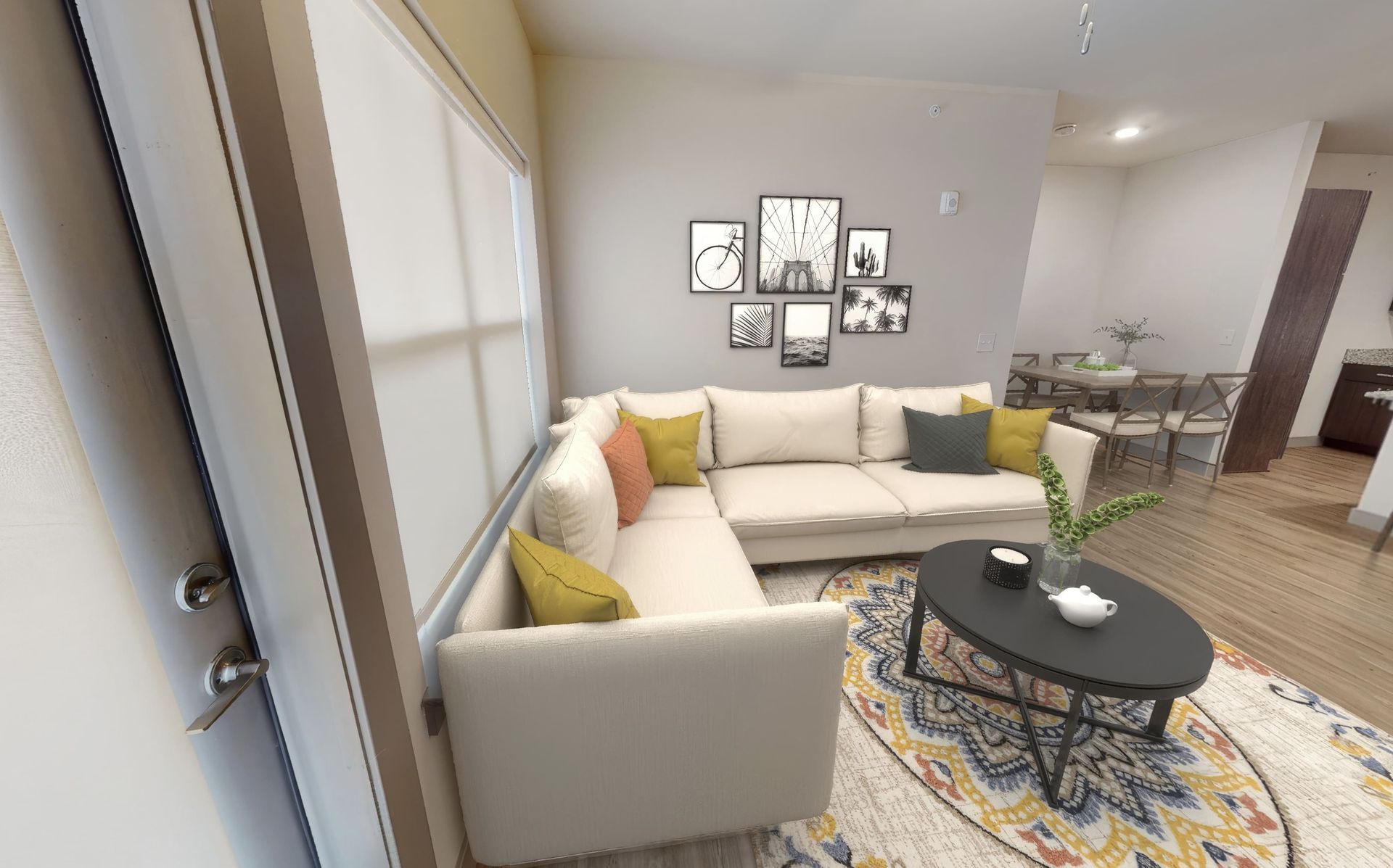 A living room with a sectional couch and a coffee table