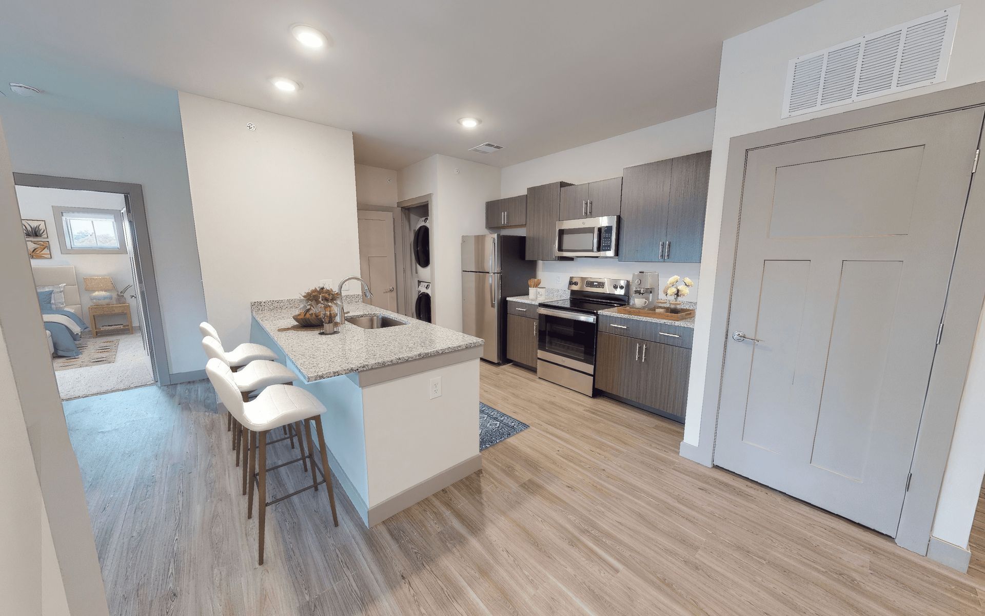 A 3d model of a kitchen with stainless steel appliances and granite counter tops.