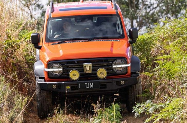 Orange Off-road Vehicle Navigating a Dirt Path — TJM Wagga Wagga In Ashmont, NSW