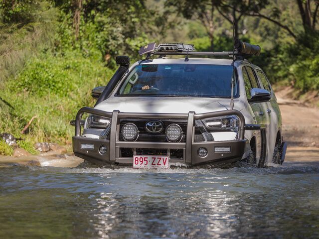 White SUV Fording a Stream, Equipped for Off-road Driving — TJM Wagga Wagga In Ashmont, NSW 