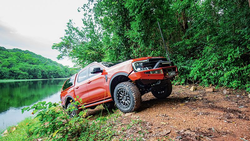 Red 4x4 Car With Lake Background — TJM Wagga Wagga In Ashmont, NSW