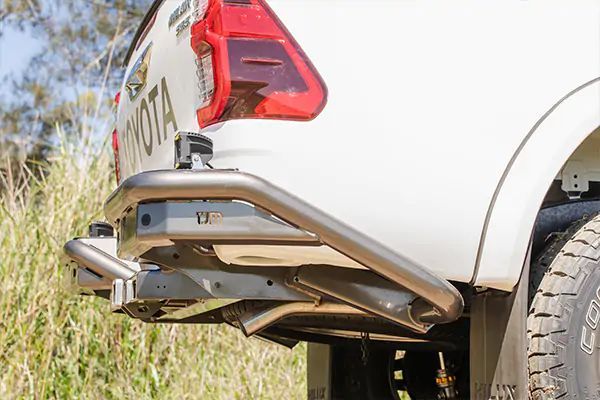 A Close-up of a White Toyota Truck's Back End With a Silver — TJM Wagga Wagga In Ashmont, NSW 