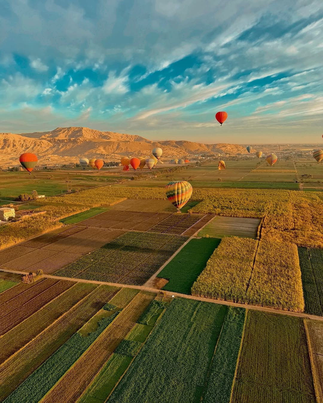 Balloons flying over Luxor during sunrise