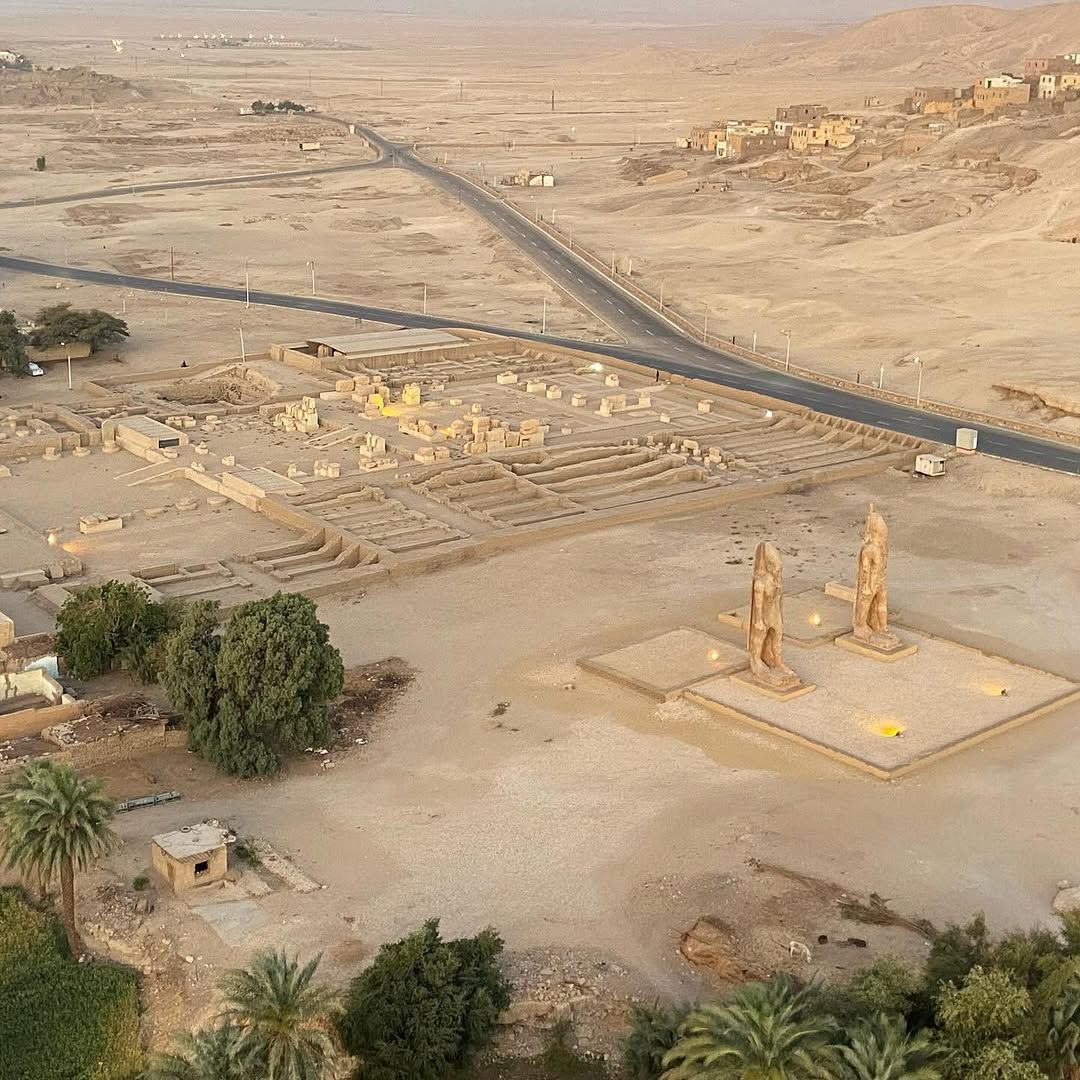 Hot air balloon floating over ancient Egyptian landscapes