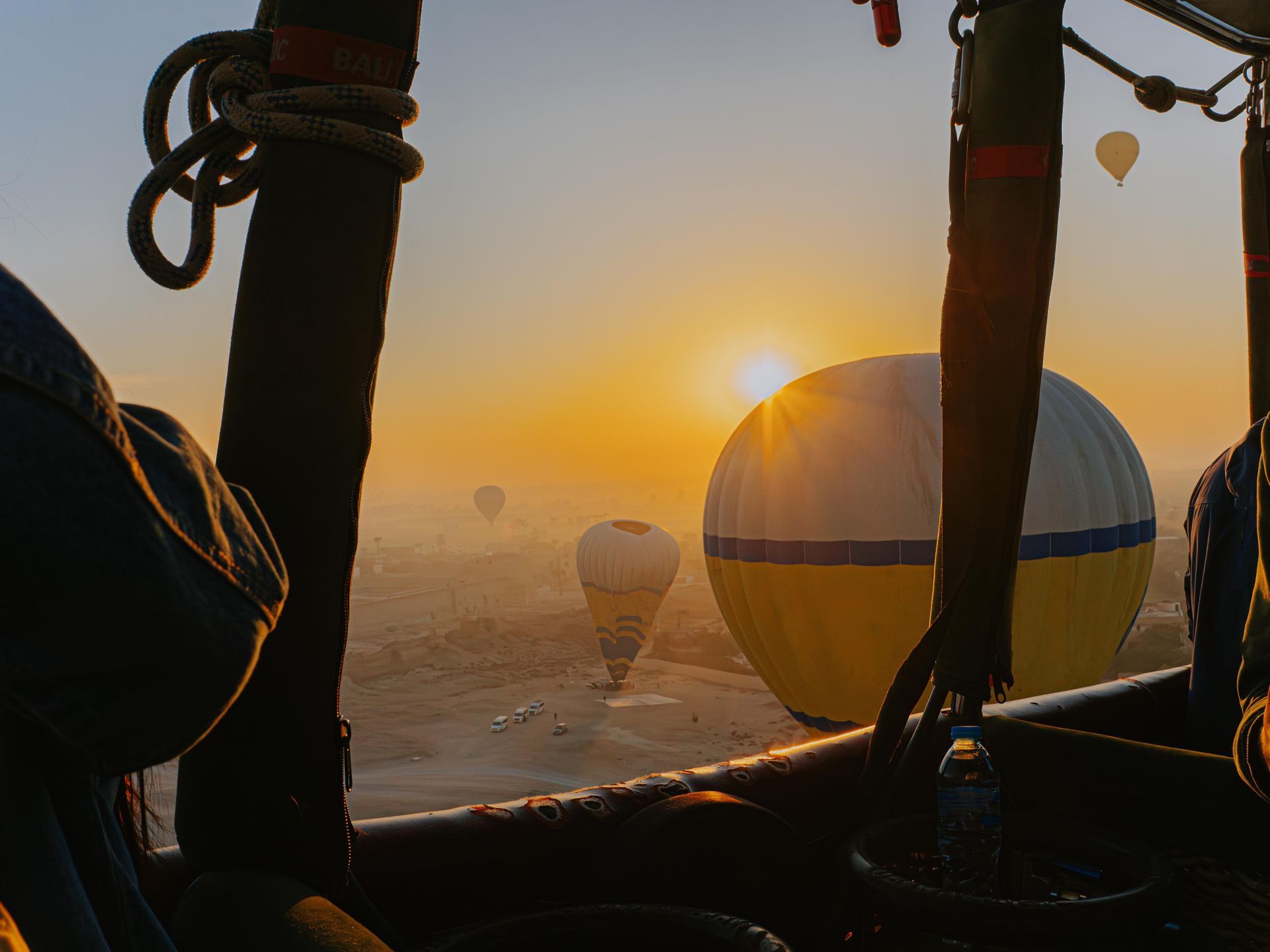Hot air balloon over Luxor near the Valley of the Kings at sunrise