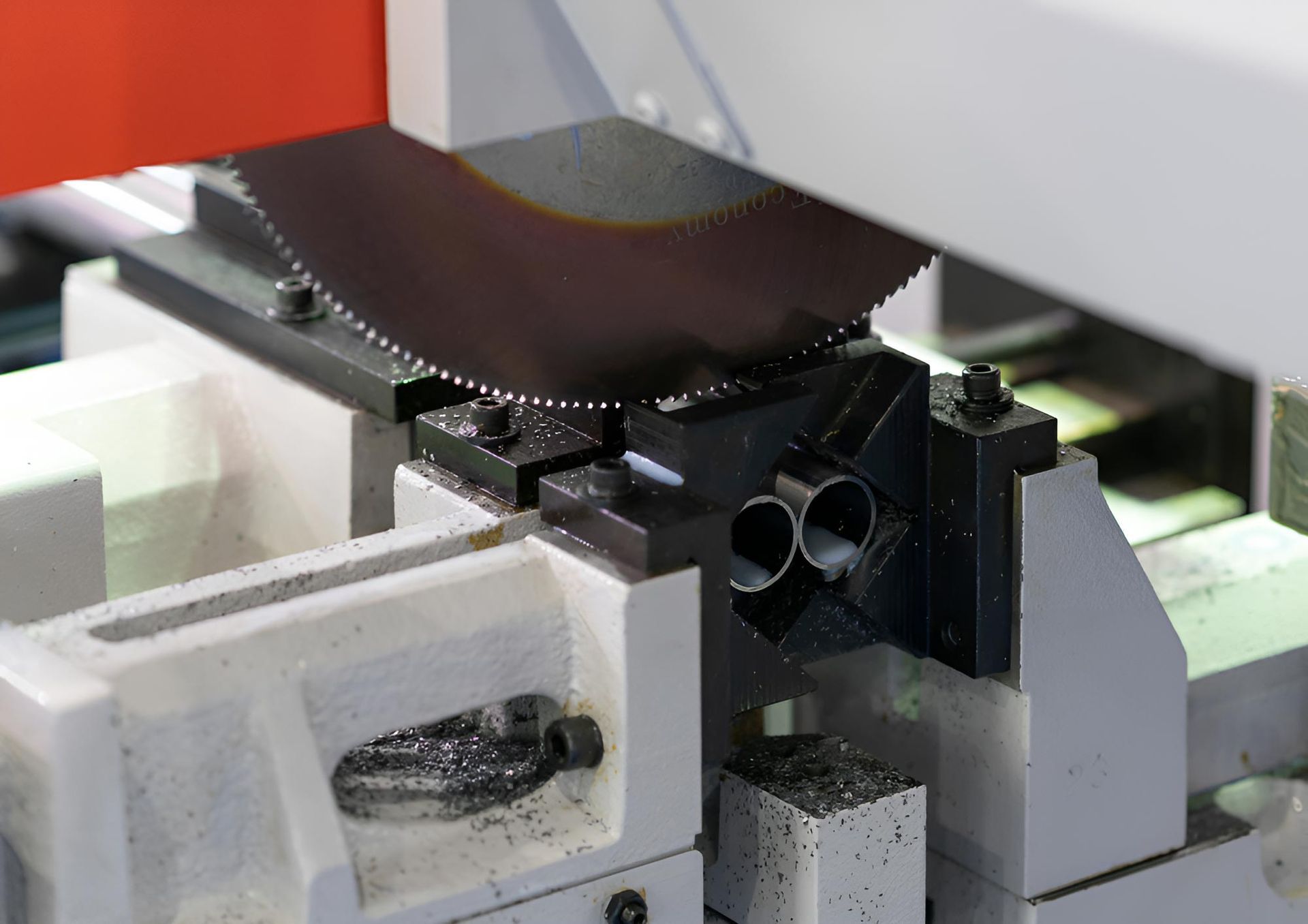 A Machine Is Cutting A Piece Of Metal With A Circular Saw — Wallers Precision Tooling  In Paget, QLD