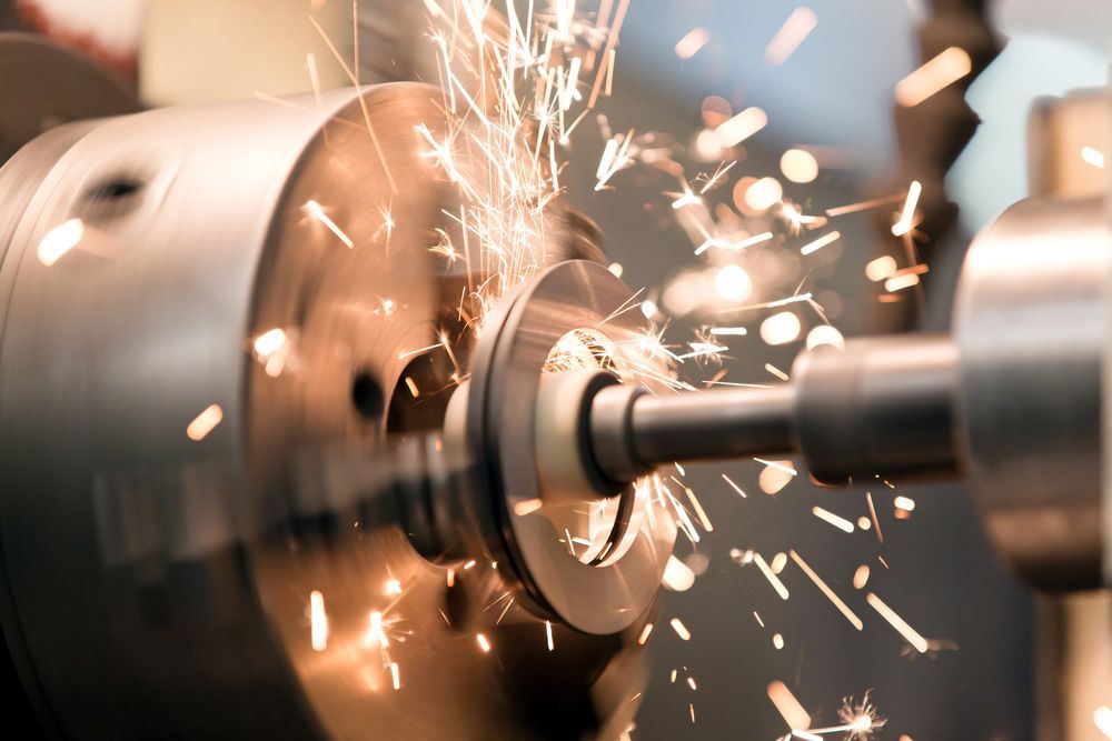 A Machine Is Cutting A Piece Of Metal— Wallers Precision Tooling In Moranbah, QLD