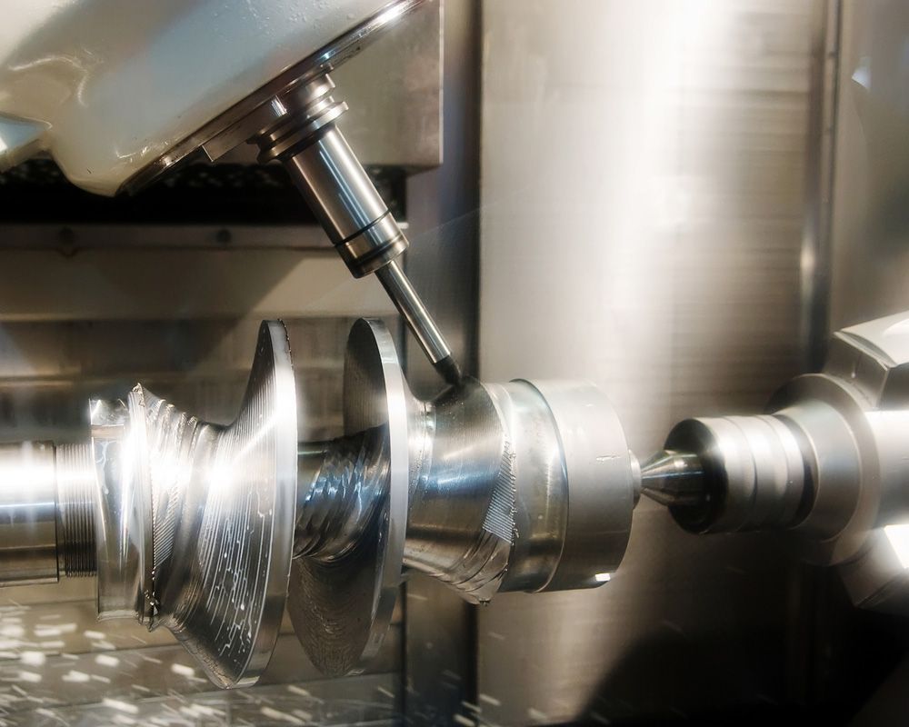 A Machine Is Cutting A Piece Of Metal In A Factory — Wallers Precision Tooling In Proserpine, QLD