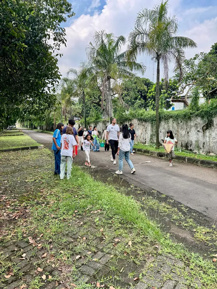 A group of people are walking down a street.