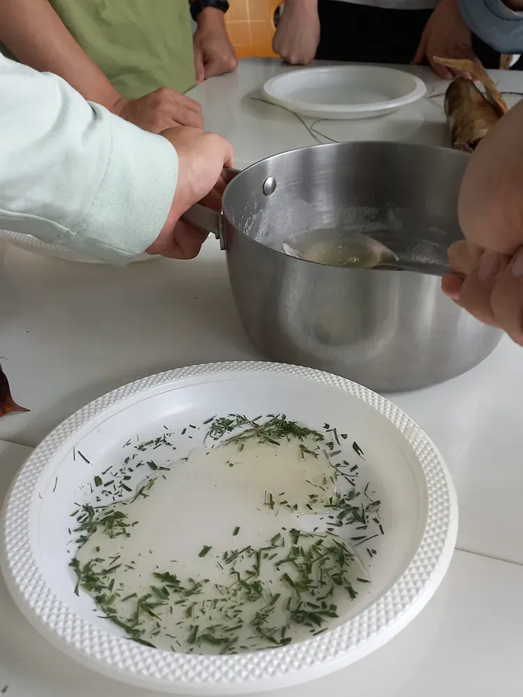 A plate of food with a bowl of food in the background