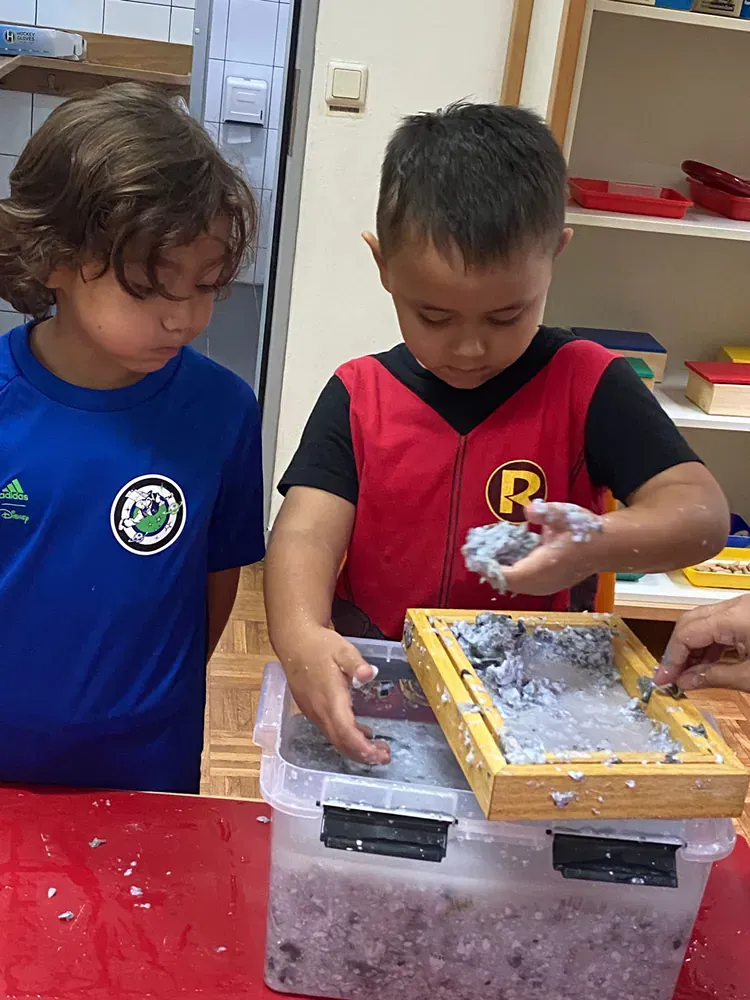 A boy in a red shirt with the letter p on it