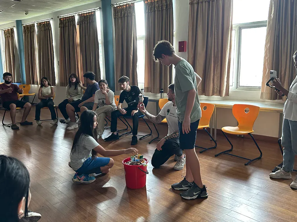 A group of people are playing a game in a room.