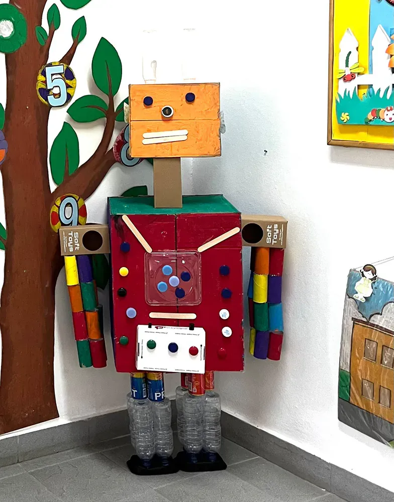 A cardboard robot with the number 5 on it