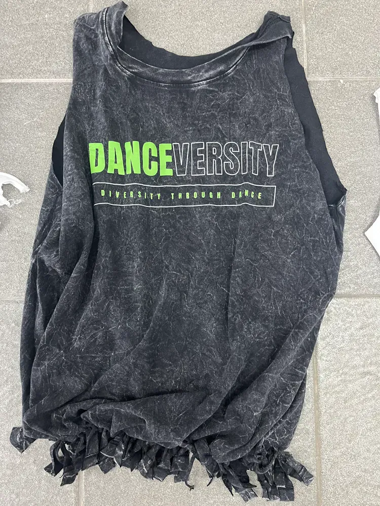 A black tank top with the words dance university on it