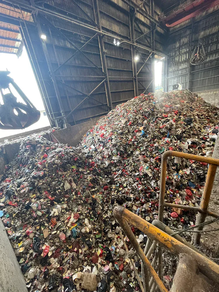 There is a large pile of trash in a building.