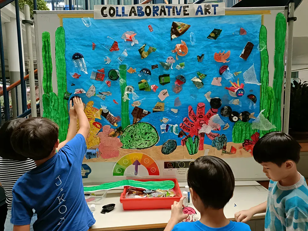 A group of children are working on a collaborative art project