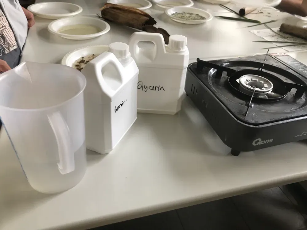 A table with a stove and a pitcher on it