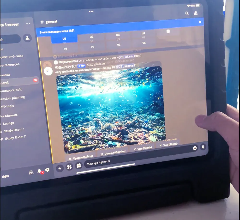 A person is using a tablet with a picture of the ocean on the screen
