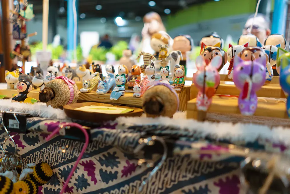 A bunch of toys are sitting on a table in a store.