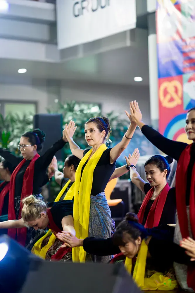 A group of women are dancing together in a room.