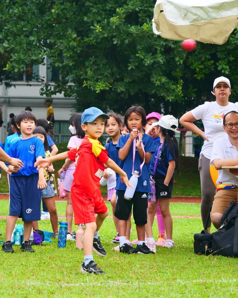 A group of children are playing a game on a field