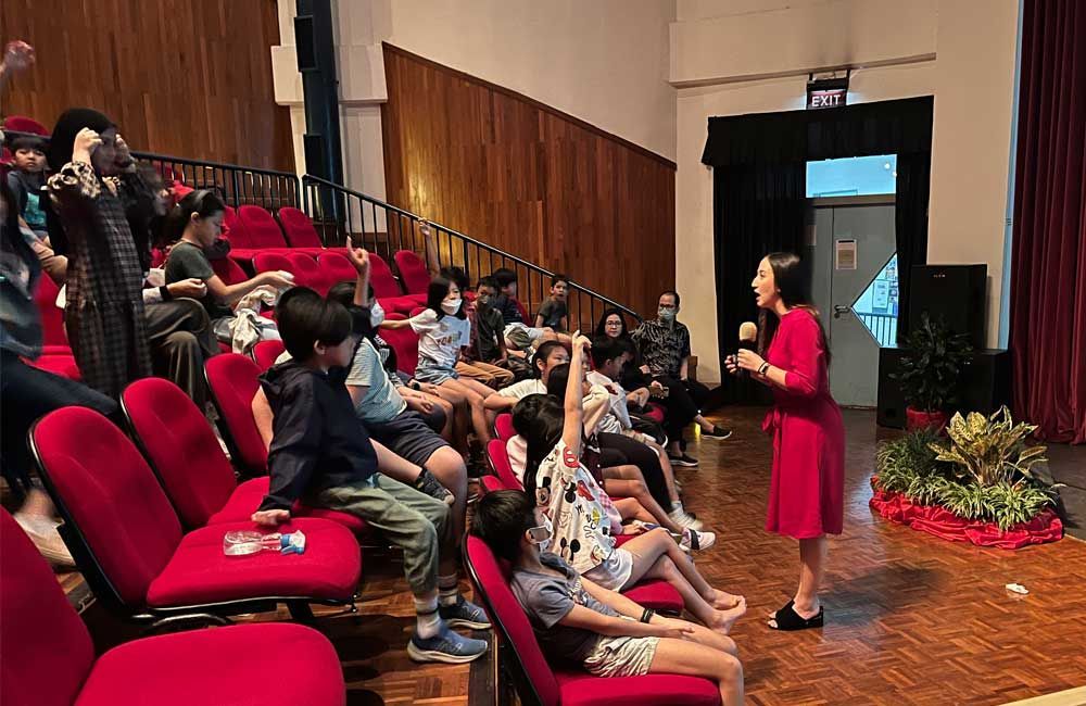 A women consultant teaching DSJ students about cyber security
