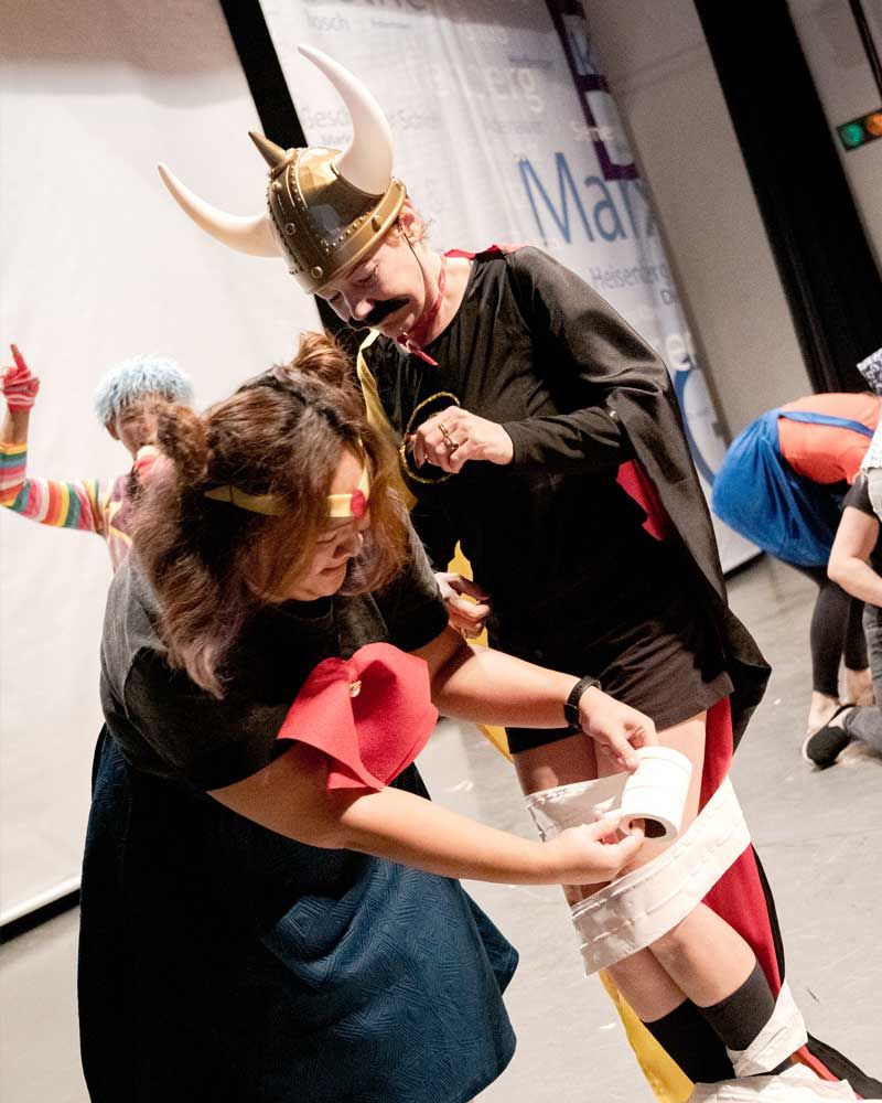 A group of people dressed up as vikings and wonder woman